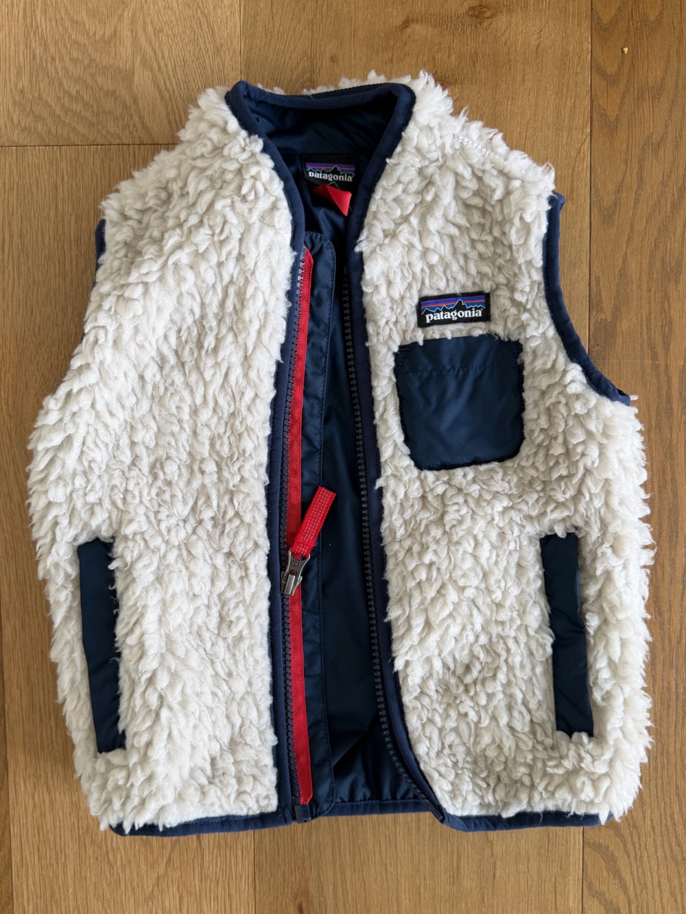 Patagonia Retro-X Cream Sherpa Vest with Navy Trim and Red Zipper Pull